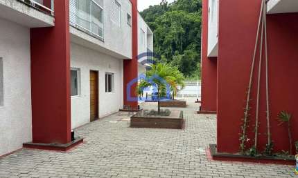 Sobrado em condomínio à venda no bairro do Massaguaçu em Caraguatatuba, SP - com 2 suítes