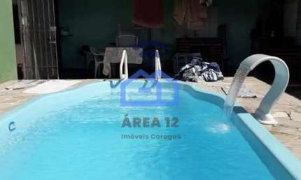 Casa com piscina à venda no bairro do Perequê Mirim em Caraguatatuba, SP