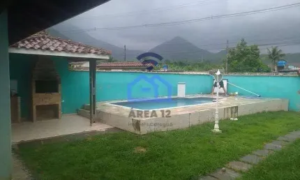 Casa de 3 dormitórios à venda no bairro do Massaguaçu em Caraguatatuba, SP - Com piscina e área gou