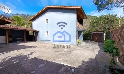 Sobrado à venda no bairro Capricórnio III em Caraguatatuba, SP com 4 amplos dormitórios, área com c