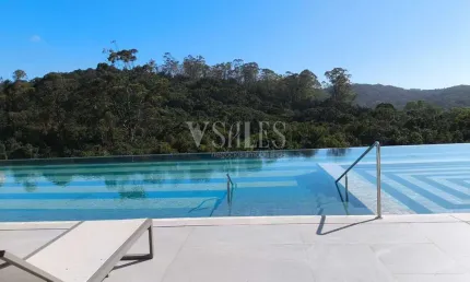 Vista panoramica da sacada gourmet com acesso ao living e suite