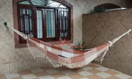 Casa Geminada com Churrasqueira e  com 2 dormitórios, sendo 1 suíte  à venda, 127 m² por R$ 520.000 - Tupi - Praia Grande/SP