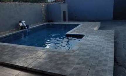 Casa com 2 dormitórios e piscina para venda no bairro Vila Cabana em Cananéia-SP