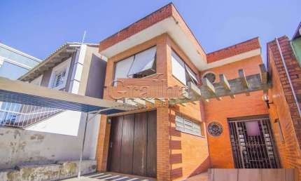 Casa com 4 quartos à venda na Rua Eudoro Berlink, 482, Auxiliadora, Porto Alegre por R$ 1.500.000