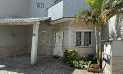 Casa em condomínio fechado com 3 quartos à venda na Rua Deputado Hugo Mardini, 1780, Passo das Pedras, Porto Alegre por R$ 699.000