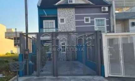 Casa em condomínio fechado com 4 quartos à venda na Rua Silvino Nedel, 100, Mário Quintana, Porto Alegre por R$ 640.000