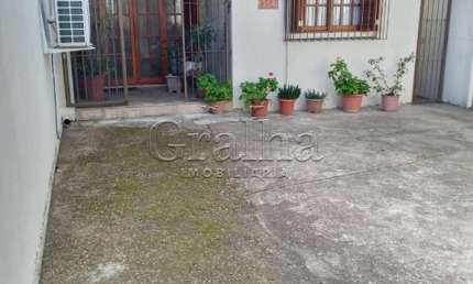 Casa com 3 quartos à venda na Rua Honório Lemos, 354, Partenon, Porto Alegre por R$ 390.000