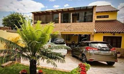 Casa com 3 quartos à venda na Rua Coronel José Rodrigues Sobral, 584, Partenon, Porto Alegre por R$ 2.100.000