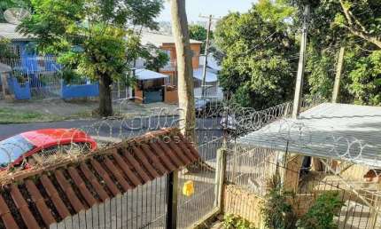 Casa com 4 quartos à venda na Rua Pedro Velho, 264, Partenon, Porto Alegre por R$ 400.000