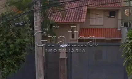 Casa com 4 quartos à venda na Rua Miguel Couto, 890, Menino Deus, Porto Alegre por R$ 1.100.000