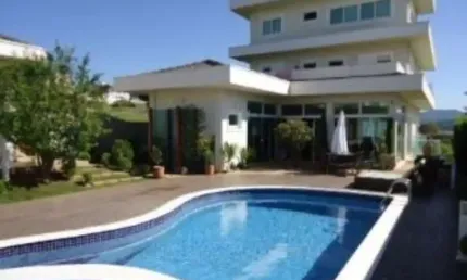 Casa alto padrão em condomínio fechado. com 4 suítes mais 1 dormitório, sala com vários ambientes