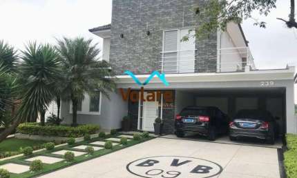 Casa de alto padrão em condomínio Alphaville, Santana de Parnaíba-SP! 4 suítes, 4 vagas de garagem, 325m² de área. Venha conferir!
