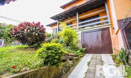 Casa com 5 quartos à venda na Rua Ângelo Passuelo, 138, Vila Nova, Porto Alegre