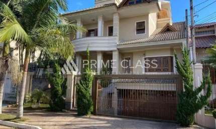 Casa com 4 quartos para alugar na Rua das Bromélias, 240, Loteamento Bela Vista, Canoas por R$ 11.700