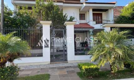 Casa com 5 quartos à venda na Rua Irmão Agnelo Chaves, 170, Marechal Rondon, Canoas por R$ 1.480.000