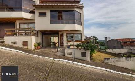Casa em condomínio fechado com 3 quartos à venda na Rua Alcebíades Antônio dos Santos, 635, Nonoai, Porto Alegre