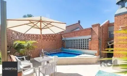 Casa em condomínio fechado com 3 quartos à venda na Avenida Jacuí, 978, Cristal, Porto Alegre