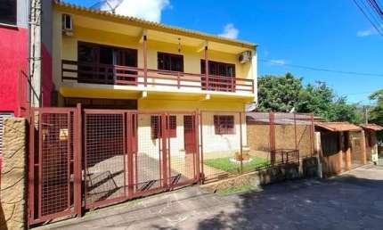 Casa 4 dormitórios à venda Vila Nova Porto Alegre/RS