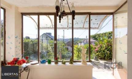 Casa com 2 quartos à venda na Rua Oscar Tollens, 242, Santa Tereza, Porto Alegre
