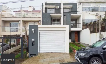 Casa com 3 quartos à venda na Rua Heitor Kramer, 680, Guarujá, Porto Alegre