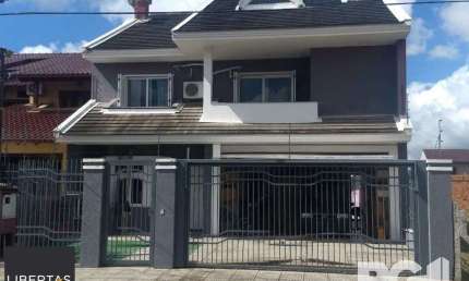 Casa 4 dormitórios à venda Parque Santa Fé Porto Alegre/RS