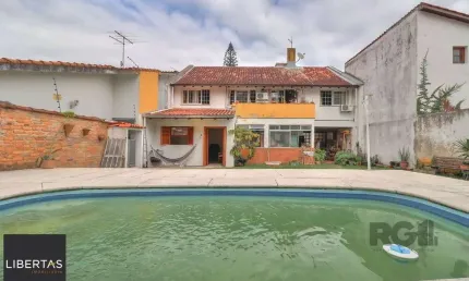 Casa a venda composta de 4 dormitórios no bairro jardim isabel em porto alegre