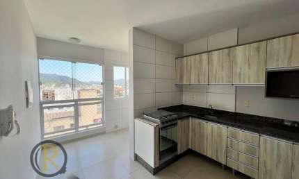 Apartamento com 2 dormitórios localizado a 400 metros do Fórum