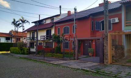 Casa com 4 quartos à venda na Rua Mário Assumpção, Guarujá, Porto Alegre