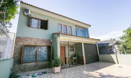 Casa com 3 quartos à venda na Rua Dário Totta, 2114, Camaquã, Porto Alegre por R$ 1.350.000