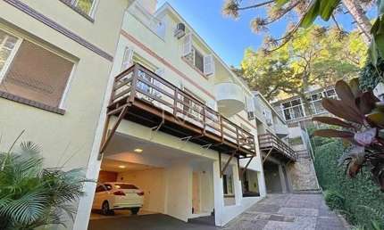 Casa em condomínio fechado com 4 quartos à venda na Avenida Coronel Marcos, 550, Pedra Redonda, Porto Alegre por R$ 980.000