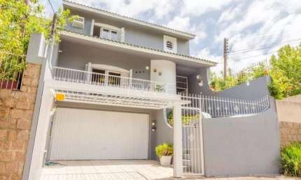 Casa com 3 quartos à venda na Rua Doutor Barcelos, 654, Tristeza, Porto Alegre por R$ 1.280.000