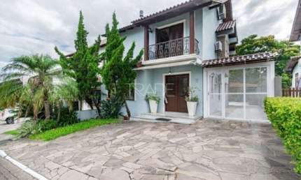 Casa em condomínio fechado com 3 quartos à venda na Avenida Edgar Pires de Castro, 540, Hípica, Porto Alegre por R$ 895.000