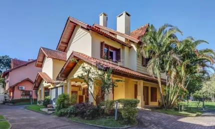 Casa em condomínio fechado com 3 quartos à venda na Rua Luís Felipe Monmany, 101, Guarujá, Porto Alegre por R$ 650.000