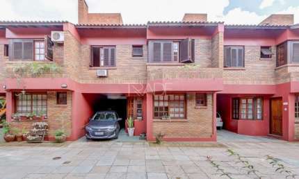 Casa em condomínio fechado com 3 quartos à venda na Avenida Coronel Marcos, 1608, Pedra Redonda, Porto Alegre por R$ 750.000