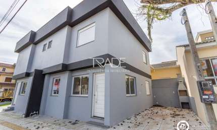 Casa com 3 quartos à venda na Rua Carlos Frederico Albers, 11, Guarujá, Porto Alegre por R$ 489.000