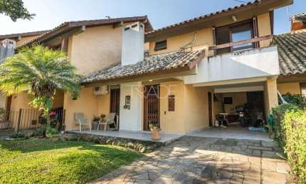 Casa em condomínio fechado com 4 quartos à venda na Rua Conselheiro Xavier da Costa, 2064, Jardim Isabel, Porto Alegre por R$ 990.000