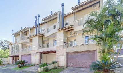 Casa em condomínio fechado com 3 quartos à venda na Avenida Coronel Marcos, 39, Pedra Redonda, Porto Alegre por R$ 980.000
