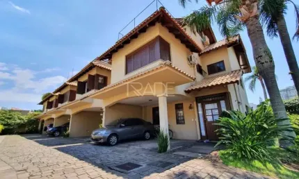 Casa em condomínio fechado com 3 quartos à venda na Rua Vicente Failace, 252, Tristeza, Porto Alegre por R$ 1.400.000