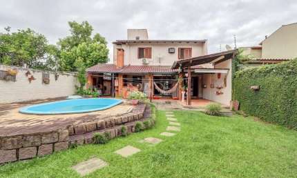 Casa com 3 quartos à venda na Avenida Guarujá, 140, Guarujá, Porto Alegre por R$ 750.000