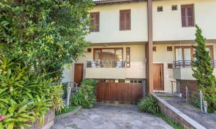 Casa em condomínio fechado com 3 quartos à venda na Rua Edgar Luiz Schneider, 550, Jardim Isabel, Porto Alegre por R$ 958.000
