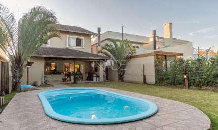 Casa em condomínio fechado com 3 quartos à venda na Avenida Juca Batista, 8000, Belém Novo, Porto Alegre por R$ 1.280.000