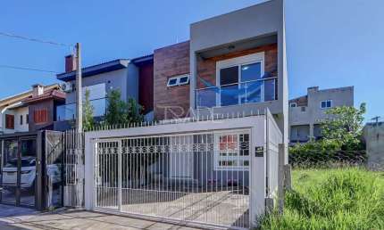 Casa com 3 quartos à venda na Rua Aldo Sani, 143, Hípica, Porto Alegre por R$ 699.000