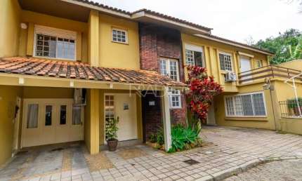 Casa em condomínio fechado com 3 quartos à venda na Rua Doutor Armando Barbedo, 832, Tristeza, Porto Alegre por R$ 800.000
