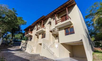 Casa em condomínio fechado com 3 quartos à venda na Avenida Vicente Monteggia, 1669, Cavalhada, Porto Alegre por R$ 495.000