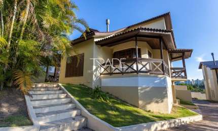 Casa em condomínio fechado com 3 quartos à venda na Avenida Vicente Monteggia, 1669, Cavalhada, Porto Alegre por R$ 650.000