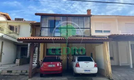 Casa em condomínio fechado com 4 quartos à venda na Rua Martim Afonso, 115, Santo Antônio, Porto Alegre por R$ 750.000