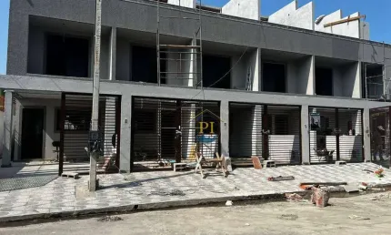 Casa com 3 dormitórios à venda, 108 m² por R$ 610.000 - Caiçara - Praia Grande/SP