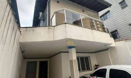 Casa com 3 dormitórios à venda, 129 m² por R$ 685.000 - Caiçara - Praia Grande/SP
