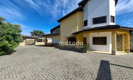 Casa com 3 dormitórios para alugar, 300 m² por R$ 9.596/mês - Condomínio Lago Dourado - Jacareí/SP