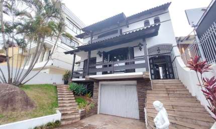 Casa com 5 dormitórios para alugar, 382 m² por R$ 7.000,00/mês - Tristeza - Port